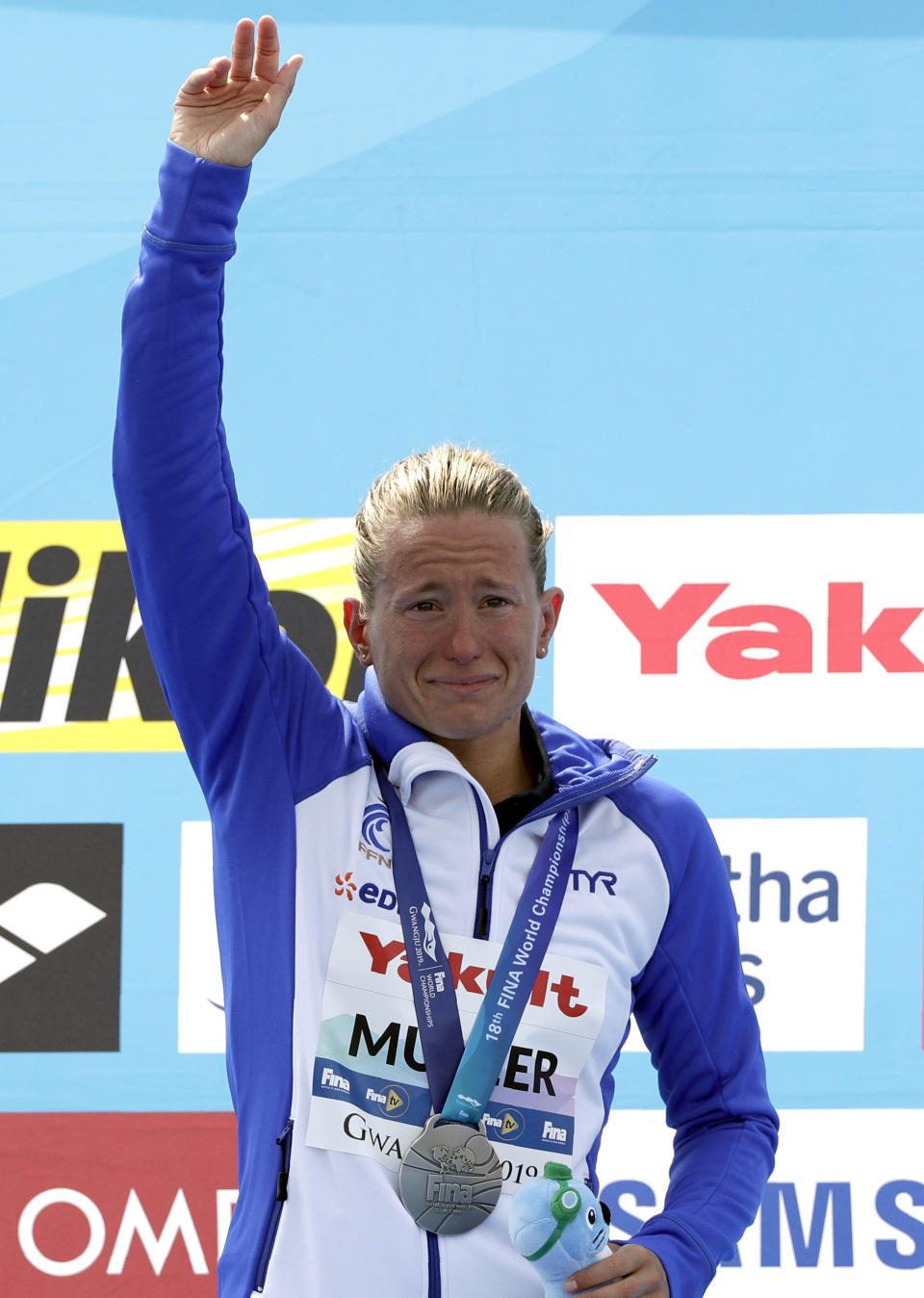 Silver medalist Aurelie Muller of France reacts after the women's 5km open water swim at the World Swimming Championships in Yeosu, South Korea, Wednesday, July 17, 2019. (AP Photo/Mark Schiefelbein)