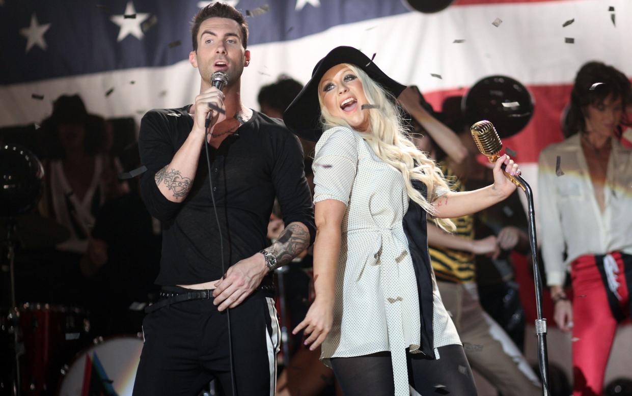 Adam Levine with Christina Aguilera in 2011 - Getty