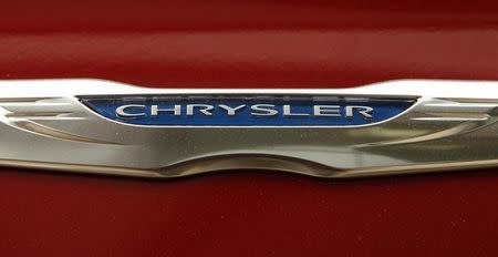A Chrysler badge is pictured on a new car at a dealership in Vienna, Virginia April 26, 2012. REUTERS/Kevin Lamarque