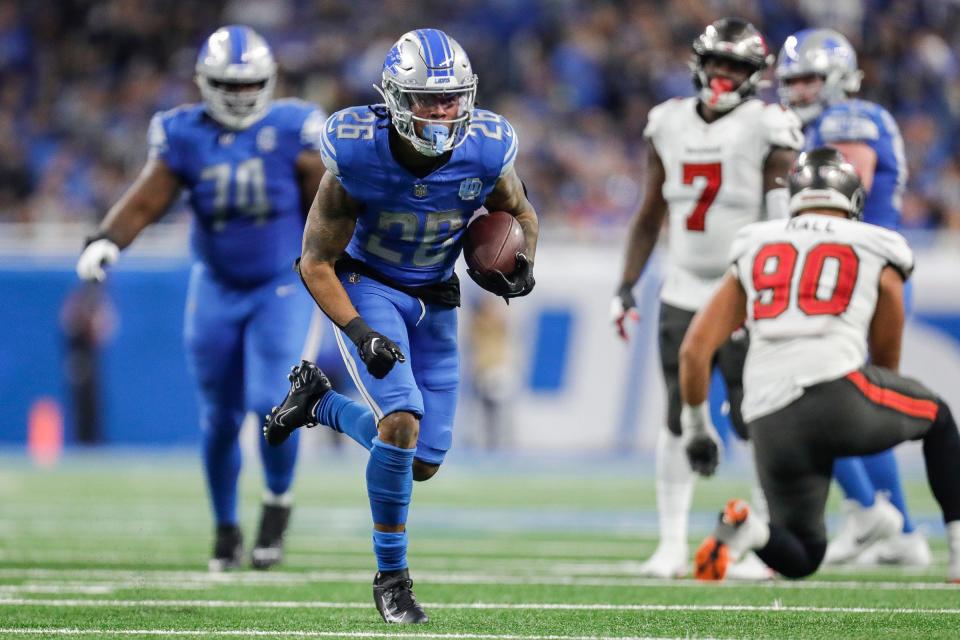 Detroit Lions running back Jahmyr Gibbs (26) runs against Tampa Bay Buccaneers during the second half of the NFC divisional round at Ford Field in Detroit on Sunday, Jan. 21, 2024.