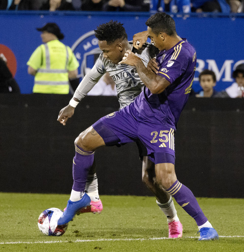 Orlando City defender Antonio Carlos, right, and CF Montreal forward Romell Quioto battle for the ball during the second half of an MLS soccer game in Montreal, Saturday, May 6, 2023. (Allen McInnis/The Canadian Press via AP)