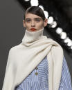 <p>Clearly, jumpers aren’t made to be worn with both arms in anymore. Didn’t see this trend coming. [Photo: PA] </p>