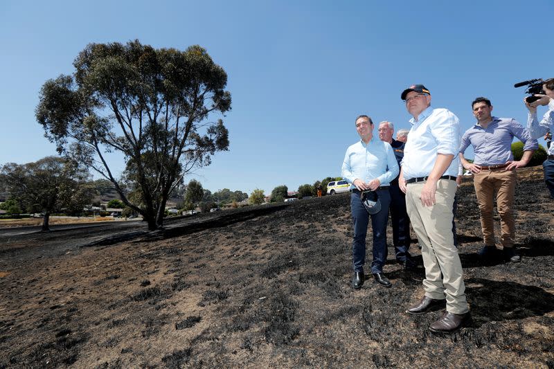 Australian Prime Minister Morrison and SA Premier Marshall stand on the burnt ground of Jacaranda Drive in Woodside following bushfires