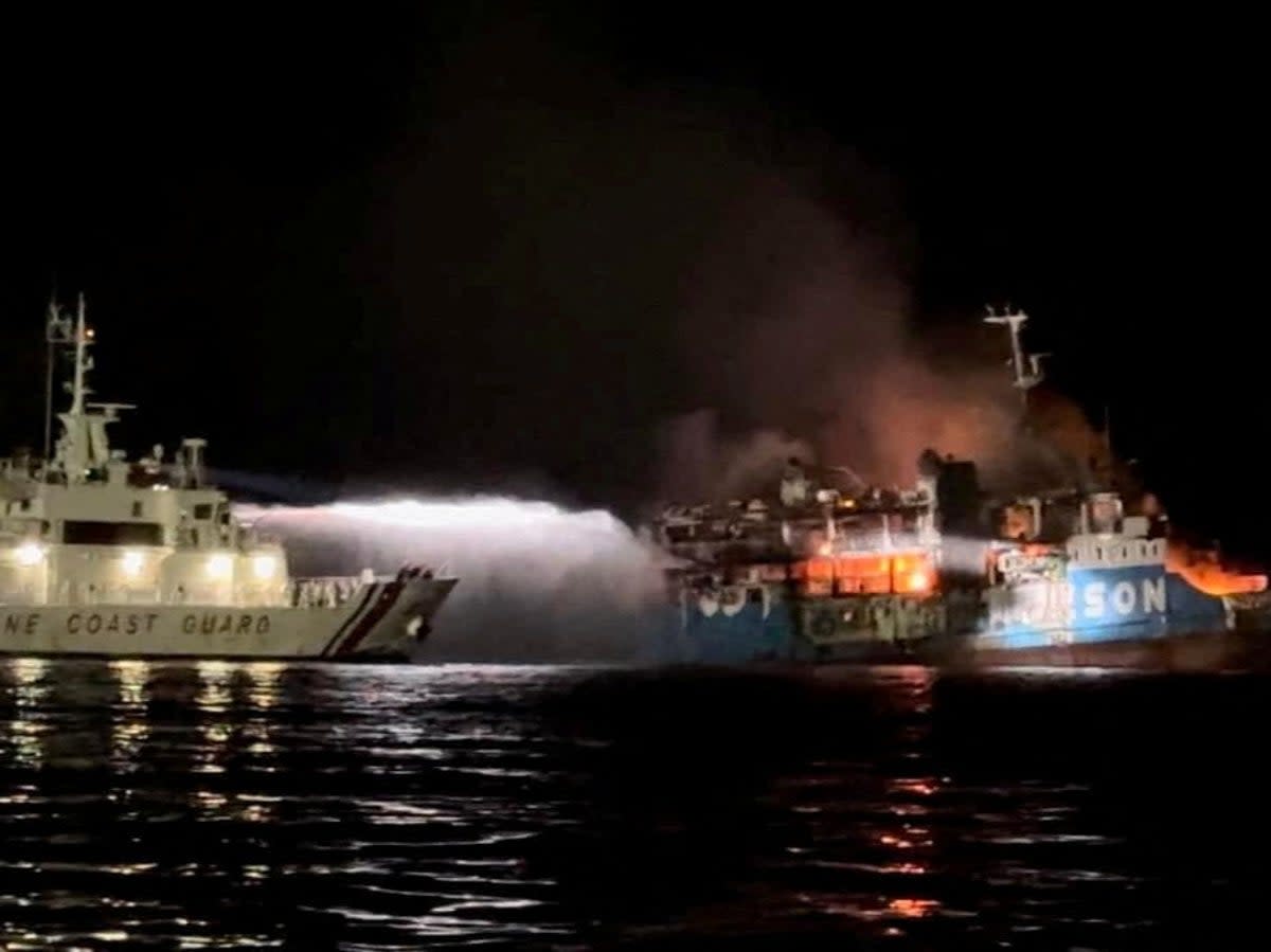 Philippine Coast Guard respond to the fire incident onboard M/V LADY MARY JOY 3 at the waters off Baluk-Baluk Island (via REUTERS)