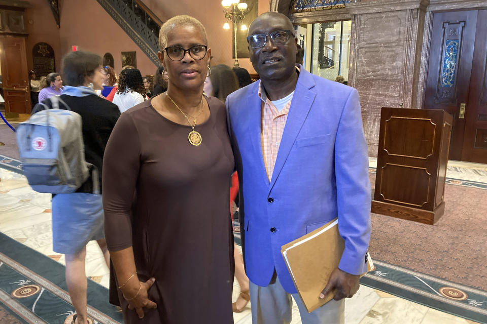 Lille Smalls, left, and her husband Carl Smalls Sr., right, pose at the South Carolina Statehouse after a news conference to speak about the killer of their son getting a deal to knock 16 years off his 35-year sentence for murder on Tuesday, April 25, 2023, in Columbia, S.C. The South Carolina Supreme Court canceled the deal on Wednesday, April 26, 2023, after a hearing. (AP Photo/Jeffrey Collins)