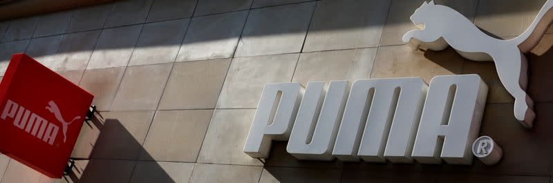 The logo of German sports goods firm Puma is seen at the entrance of one of its stores in Vienna