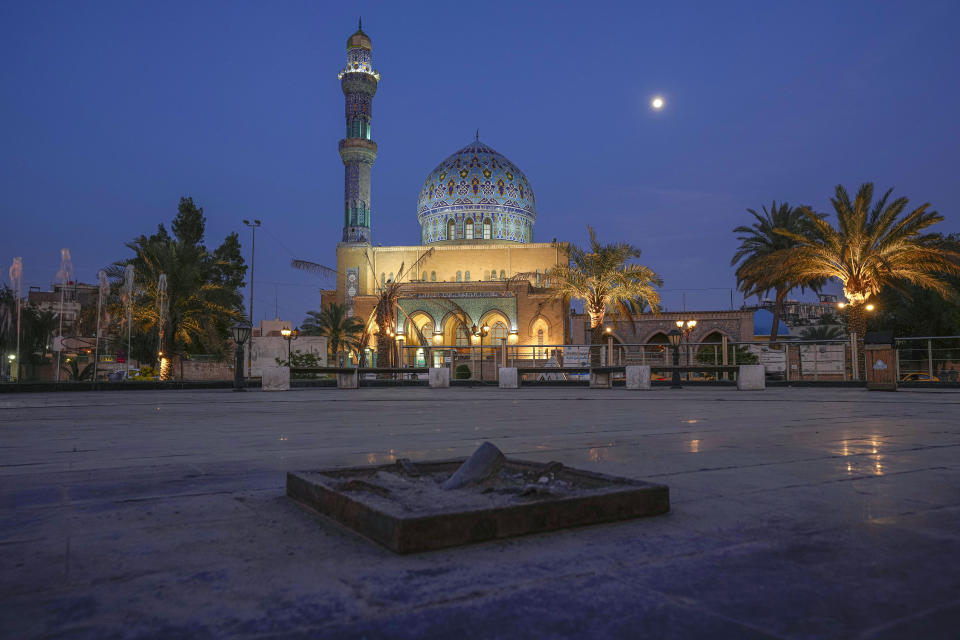 Firdous Square in Baghdad where American marines took down a statue of former Iraqi President Saddam Hussein in April 2003 is seen in Baghdad, Iraq, Tuesday, April. 4, 2023. In the background is the 14th of Ramadan Mosque. (AP Photo/Hadi Mizban)
