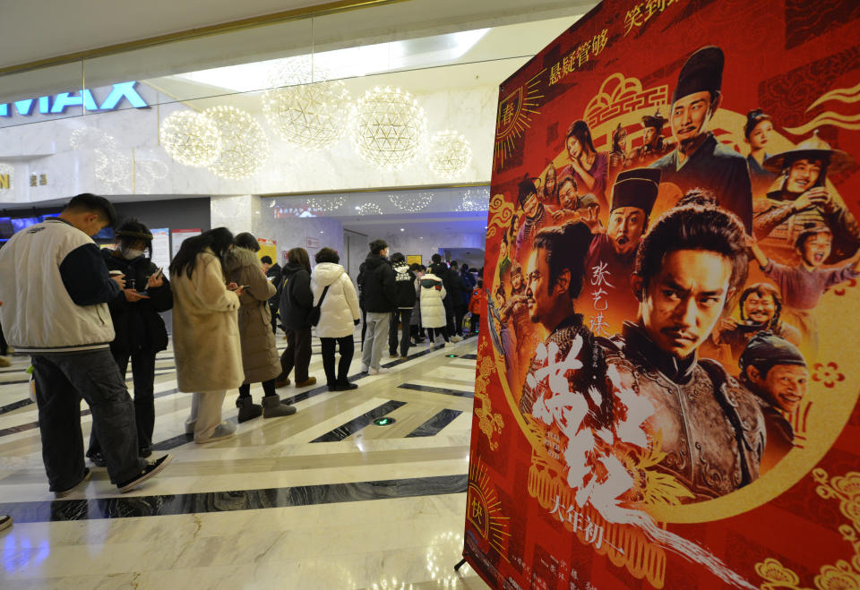 FUYANG, CHINA - JANUARY 24, 2023 - People line up to watch a movie at Dongfang Grand Screen Cinema in Fuyang City, East China's Anhui Province, Jan 24, 2023. : As of 17:35 on 24th, the total box office of 2023 Spring Festival (January 21 - January 27) (including pre-sales) has exceeded 3.5 billion yuan, 3.635 billion yuan! The top three at the Chinese New Year box office so far are 