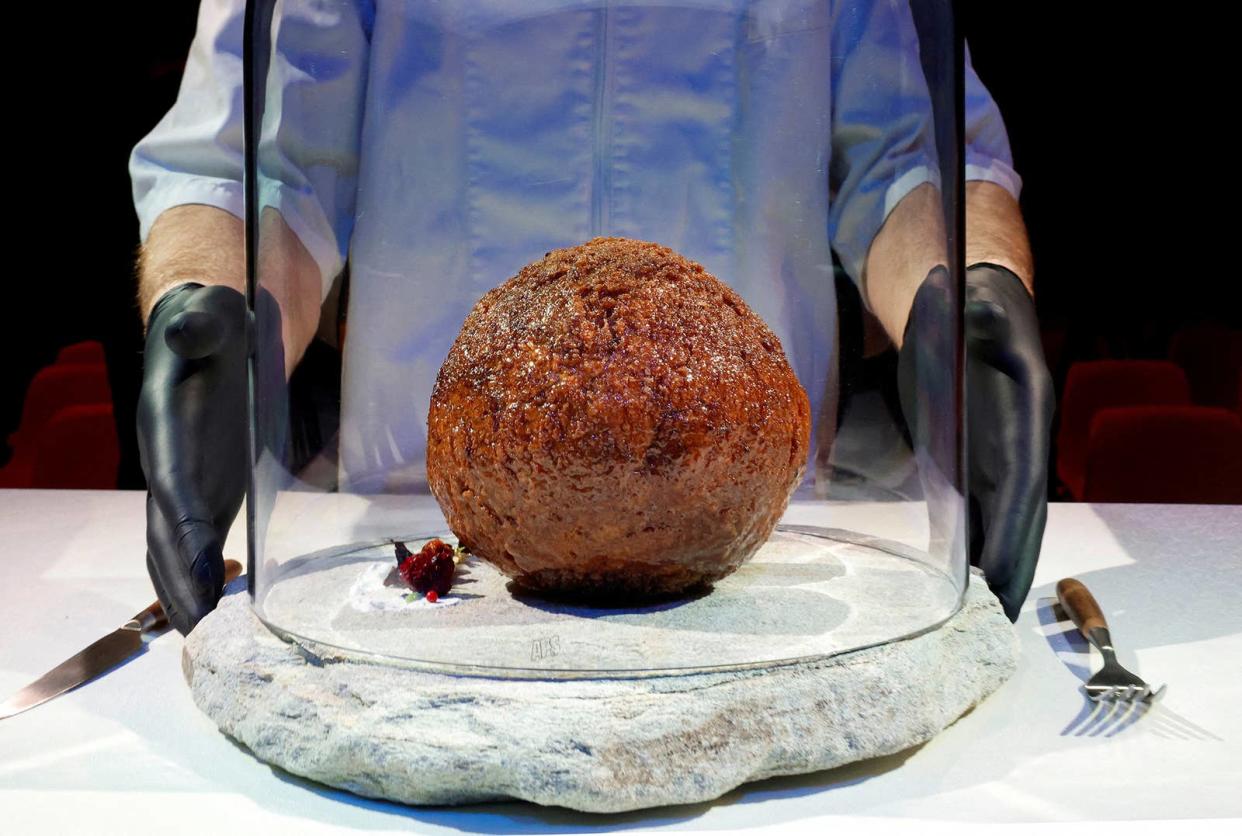 A meatball made from flesh cultivated using the DNA of an extinct woolly mammoth is presented at NEMO Science Museum in Amsterdam, on March 28, 2023.