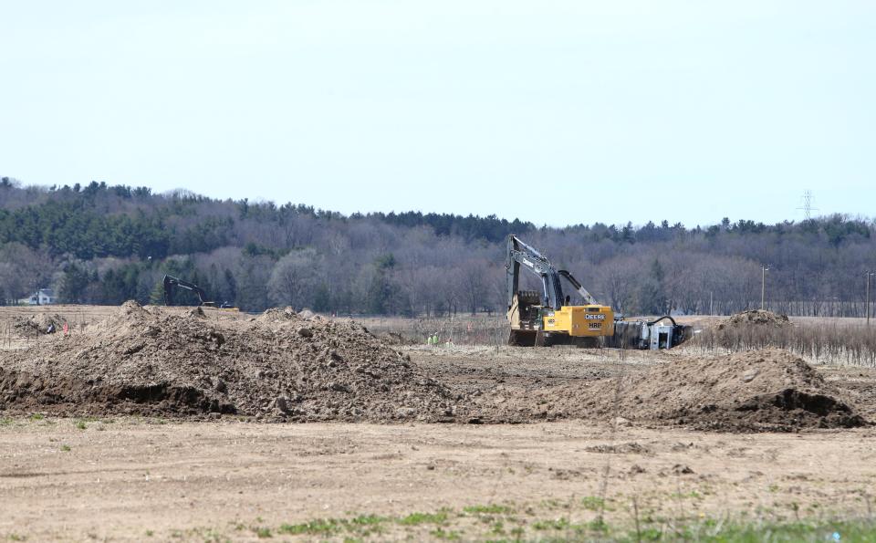 Crews perform excavation work Tuesday, April 9, 2024, on Fillmore Road west of Larrison Boulevard near New Carlisle.