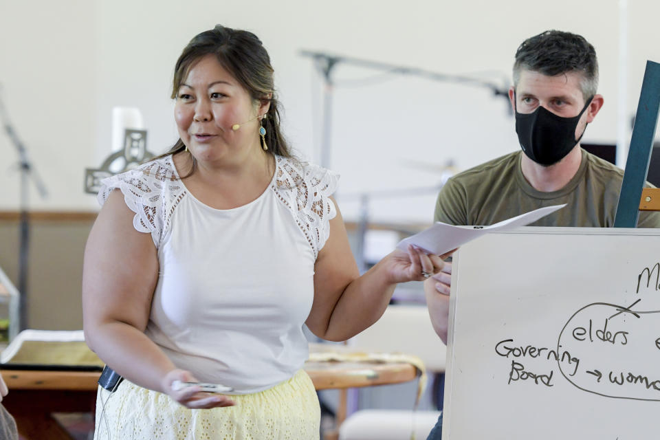 Pastor Juliet Liu of Life on the Vine church speaks during a congregational meeting in Long Grove, Ill., on Sunday, May 22, 2022. “For me, it’s not just the pandemic, but also the conversations about race and the anti-Asian hate – it’s all been really rough,” said Liu, whose is of Taiwanese and Vietnamese descent. Her congregation is predominantly white and about 20% Asian American. (AP Photo/Mark Black)