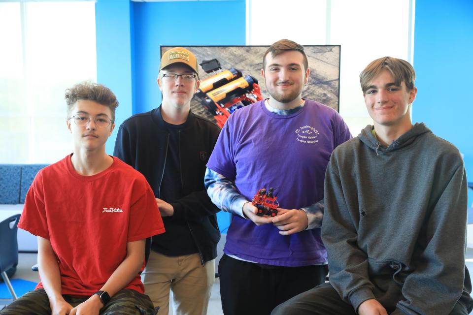 Dutchess BOCES students, from left, Daniel Nieves Gamboa, Connor Young, Tyler Bloomer and Matthew Burris with  their robot which they created for a project from Onsemi in Poughkeepsie on May 18, 2023. 