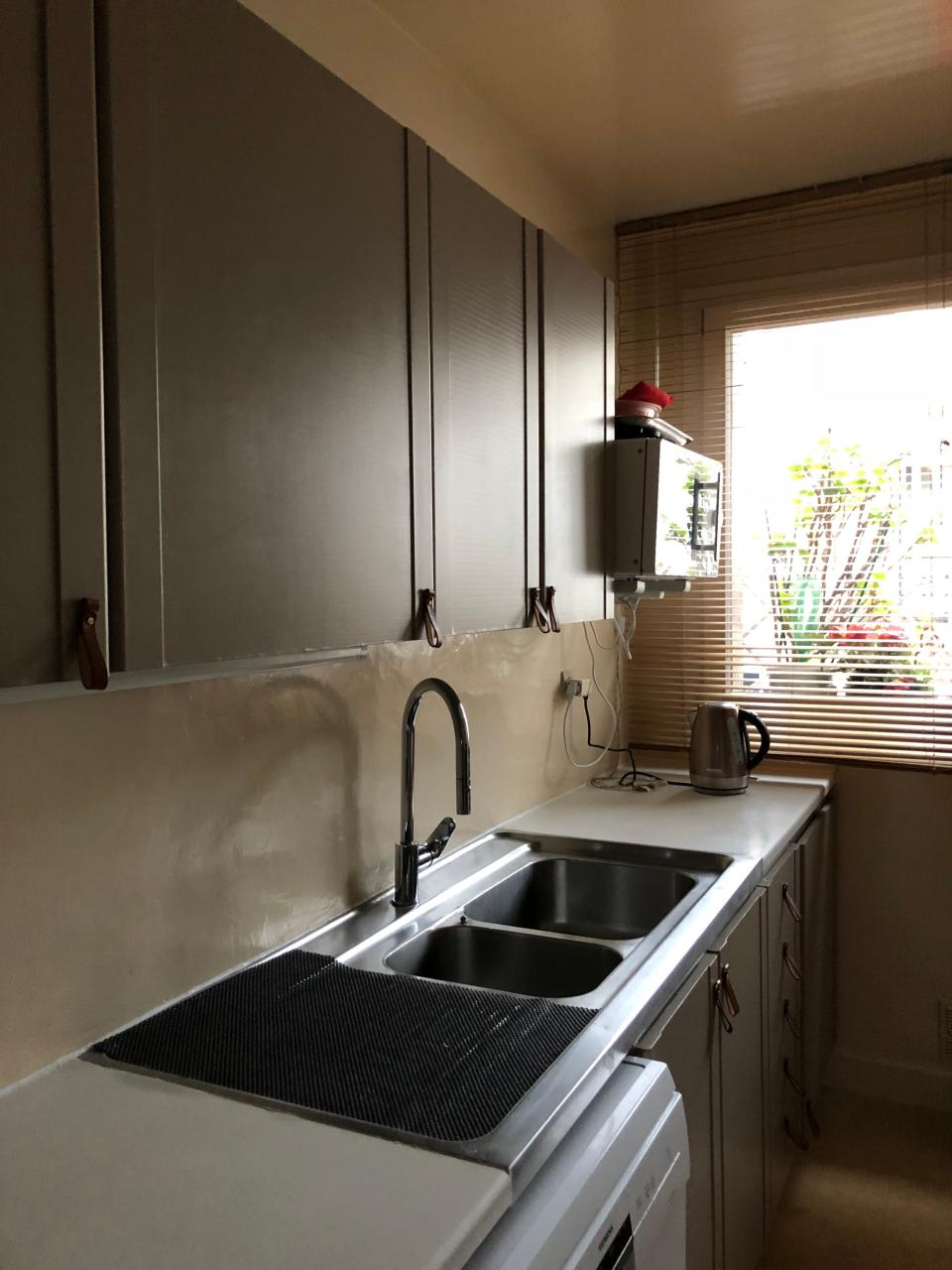 BEFORE: The basic layout of the kitchen was fine but needed a jolt of color and modernity.