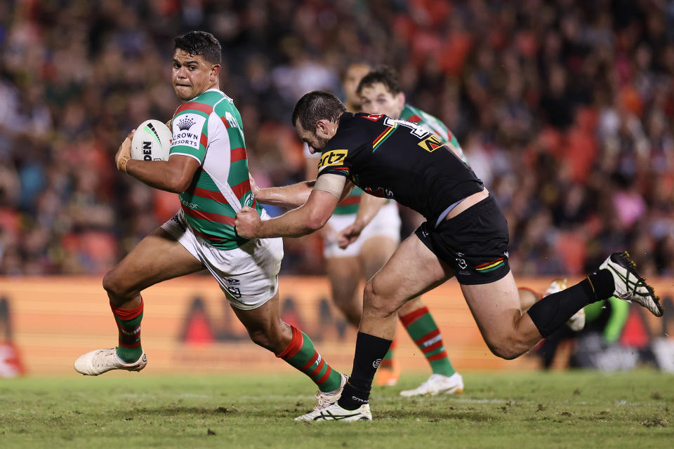 Seen here, Rabbitohs fullback Latrell Mitchell is tackled by Penrith's Isaah Yeo.