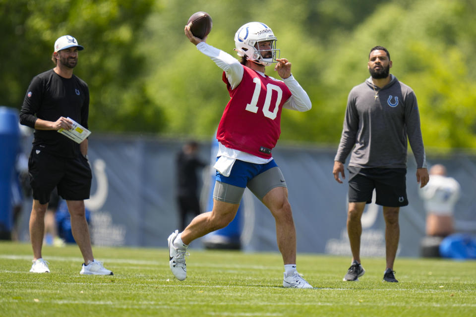 FILE - Indianapolis Colts quarterback Gardner Minshew II throws during practice at the NFL football team's training facility in Indianapolis, Thursday, May 25, 2023. The Indianapolis Colts will start this season with another new quarterback behind center. The big question is who will it be? After parting ways with veterans Matt Ryan and Nick Foles after one season, the Colts signed former NFL starter Minshew and drafted Anthony Richardson with the fourth overall pick. (AP Photo/Michael Conroy, File)