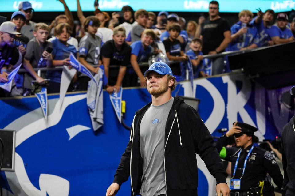Lions defensive end Aidan Hutchinson walks onto the field for warm up before a preseason game against the Giants at Ford Field on Friday, Aug. 11, 2023.