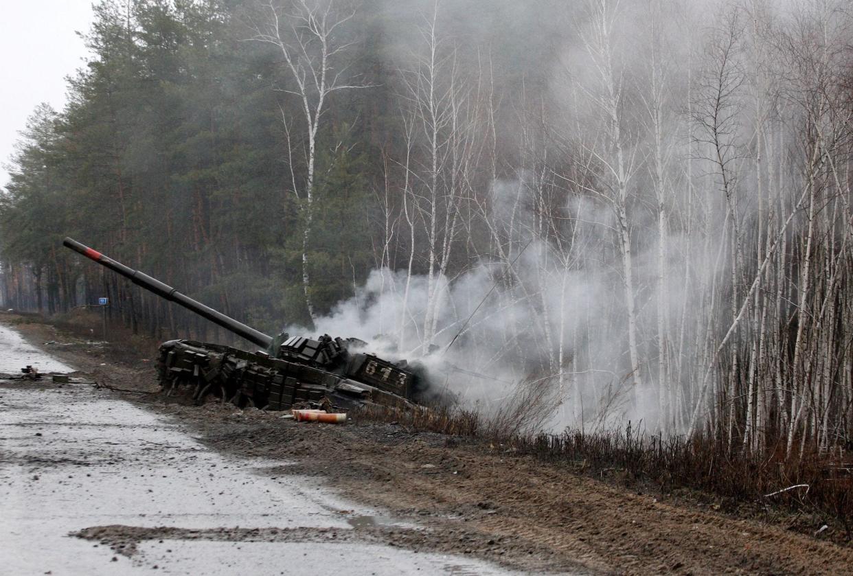 Smoke rises from a Russian tank destroyed by the Ukrainian forces on Feb. 26.