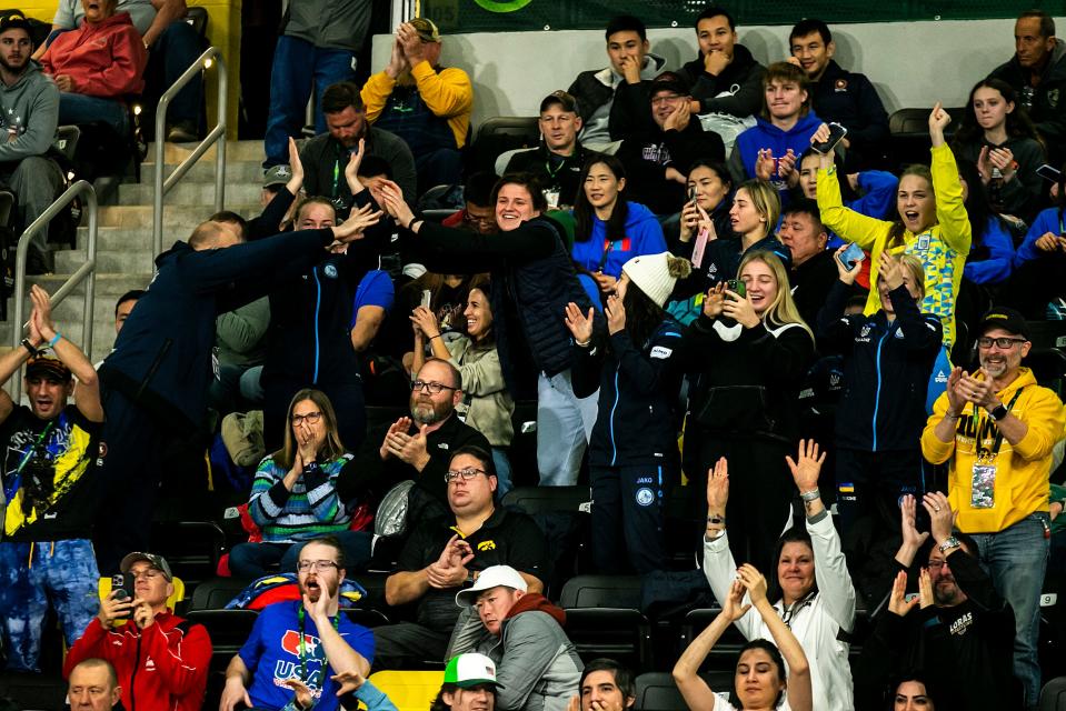 Fans react during championship finals of the United World Wrestling women's freestyle World Cup between Ukraine and China on Sunday