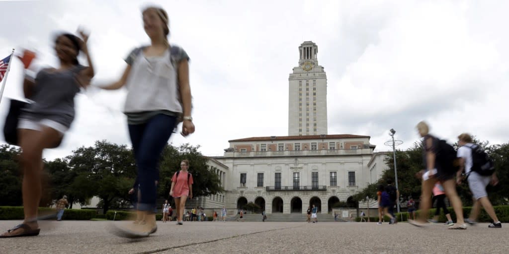 In this Sept. 27, 2012, file photo, students walk through the University of Texas at Austin campus near the school’s iconic tower in Austin, Texas. (AP Photo/Eric Gay, File)