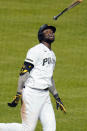 Pittsburgh Pirates' Gregory Polanco tosses his bat after driving in the winning run with a sacrifice fly off San Francisco Giants relief pitcher Caleb Baragar during the 11th inning of a baseball game in Pittsburgh, Friday, May 14, 2021. (AP Photo/Gene J. Puskar)