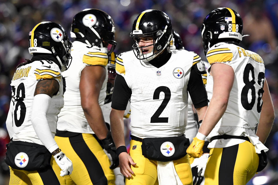 Pittsburgh Steelers quarterback Mason Rudolph (2) reacts after throwing a touchdown pass against the Buffalo Bills during the fourth quarter of an NFL wild-card playoff football game, Monday, Jan. 15, 2024, in Buffalo, N.Y. (AP Photo/Adrian Kraus)