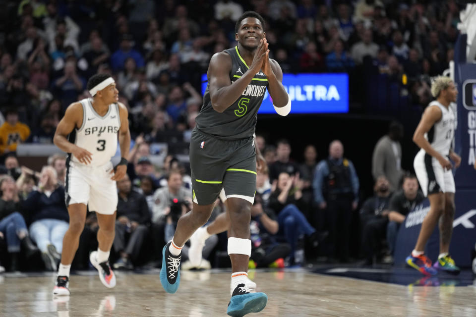 Minnesota Timberwolves guard Anthony Edwards (5) reacts after making a three-point shot during the second half of an NBA basketball game against the San Antonio Spurs, Wednesday, Dec. 6, 2023, in Minneapolis. (AP Photo/Abbie Parr)