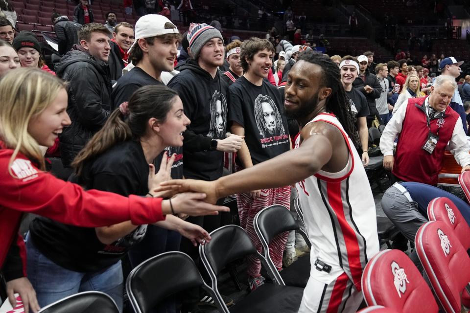 Jan 20, 2024; Columbus, Ohio, USA; Ohio State Buckeyes guard Bruce Thornton (2) high fives fans following the NCAA men’s basketball game against the Penn State Nittany Lions at Value City Arena. Ohio State won 79-67.
