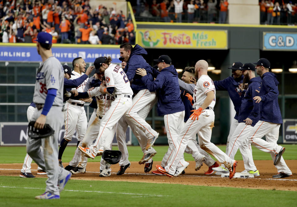 The Astros celebrate after Alex Bregman’ game-winning single during Game 5 of the World Series. (AP)