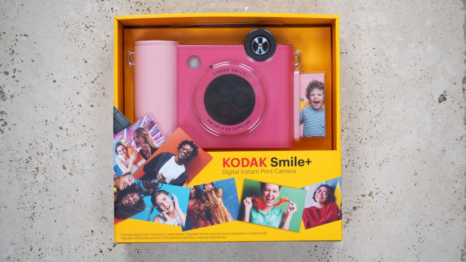 Kodak Smile+ camera in pink in a retail box on a marbled surface