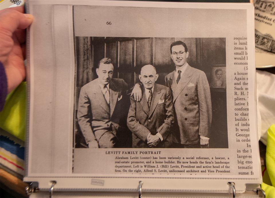 Copy of a Levitt family portrait, depicting William Levitt, from the left, Abraham Levitt, and Alfred Levitt, on display at Dave Marable's Levittown Museum, on Monday, Jan. 10, 2022.