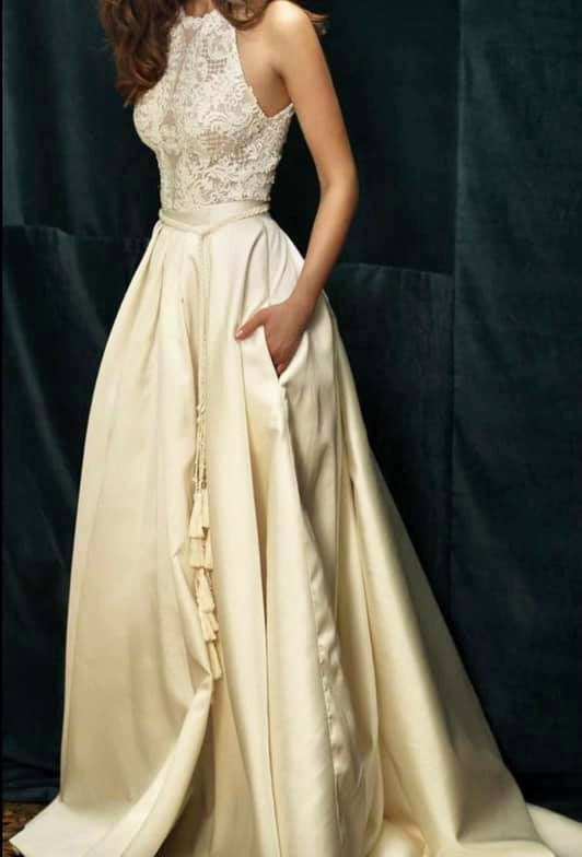 Image of woman modelling wedding gown with curtain tassel belt