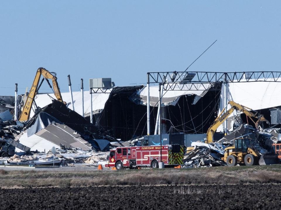 Construction crews work at the site of a roof collapse at an Amazon distribution center in Edwardsville, Illinois, US December 11, 2021.