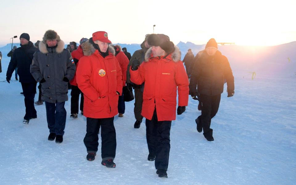 Russian President Vladimir Putin and Prime Minister Dmitry Medvedev visit Franz Josef Land archipelago in Arctic Russia - Credit: Pool Sputnik Photo/AP