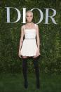 <p>The former model opted for a white babydoll dress and leg-lengthening thigh-high boots.<br><i>[Photo: Dior]</i> </p>