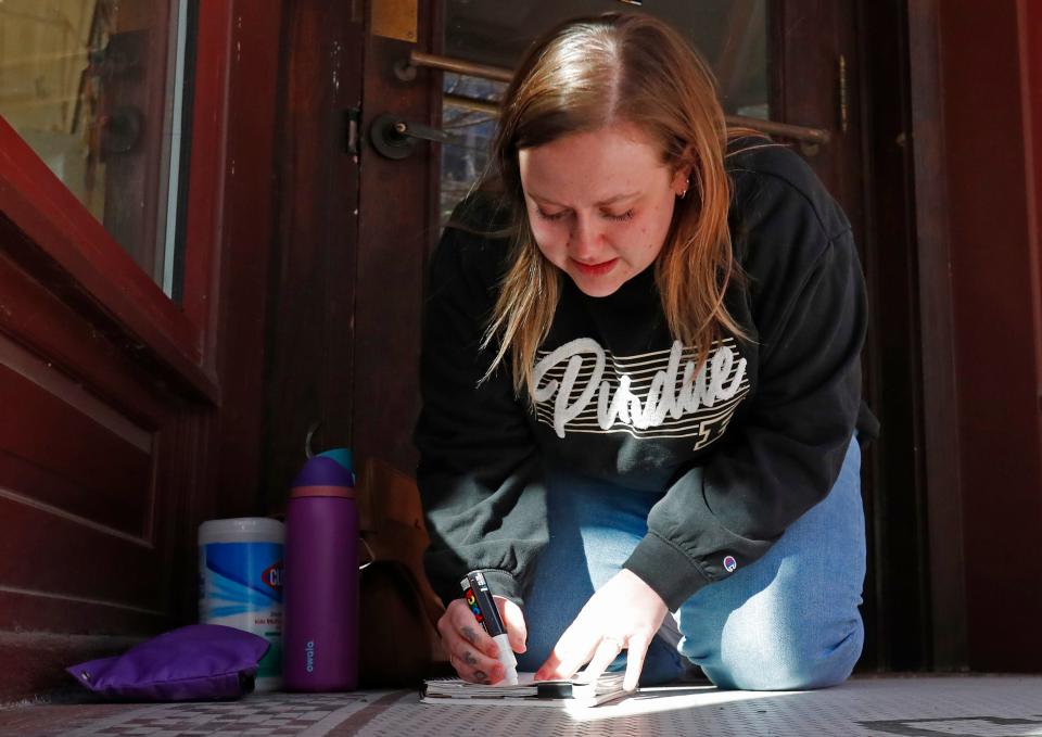 Natalie Martinez works on a sign, Wednesday, March 20, 2024, at Flourish Studio and Classroom in Lafayette, Ind.