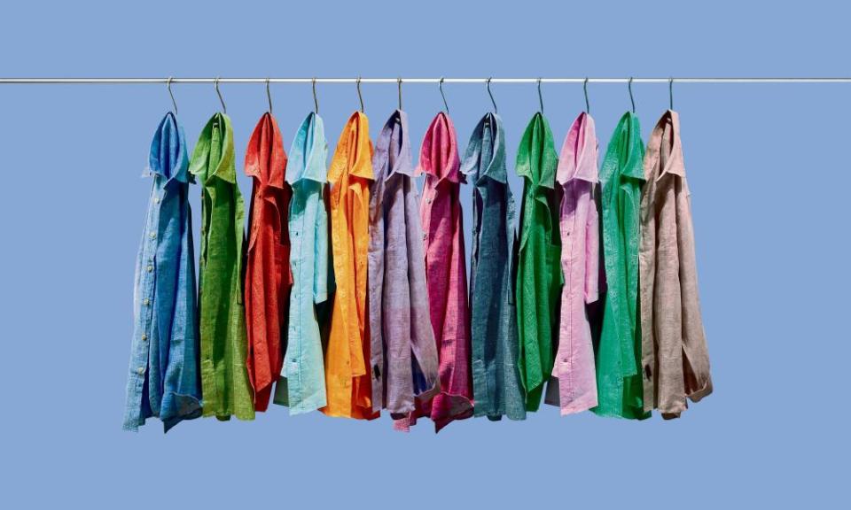 Colorful shirts hanging on hooks.