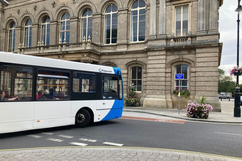 A Stagecoach bus turns by Grimsby Town Hall. The Lib Dems would like some routes re-designed, and for service deficiencies in local buses addressed