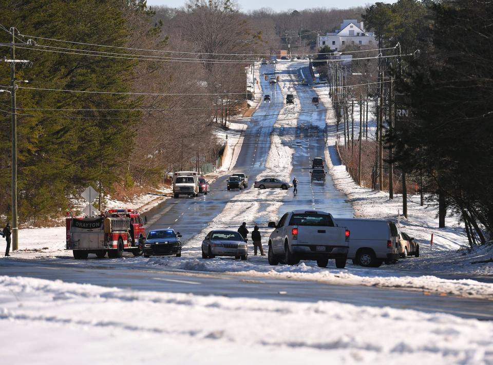 Law enforcement, including SC Highway Patrol, temporarily shut down Drayton Road following a few accidents in an area of the road due to icy conditions, Tuesday morning, January 18, 2022. 
