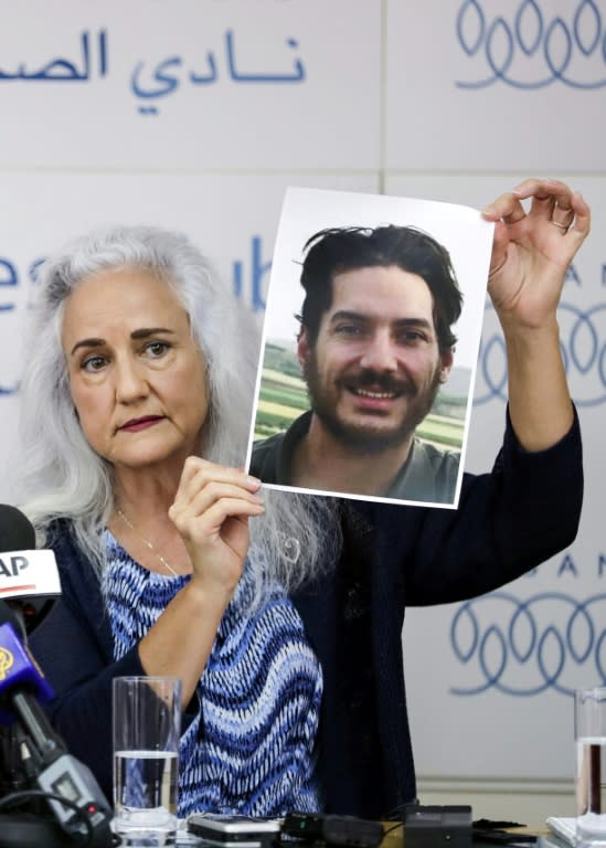 Debra Tice, mother of US journalist Austin Tice who was kidnapped in Syria in 2012, holds a portrait of him during a press conference in the Lebanese capital Beirut on July 20, 2017