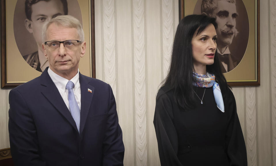 Maria Gabriel, right, the prime minister-designate under a power-sharing deal by the two main political parties, is seen next to the former PM Nikolay Denkov of the reformist coalition led by "We Continue the Change," before obtaining the mandate to form a new government at the Bulgarian Presidency in Sofia, Monday, March 18, 2024. (AP Photo/Valentina Petrova)