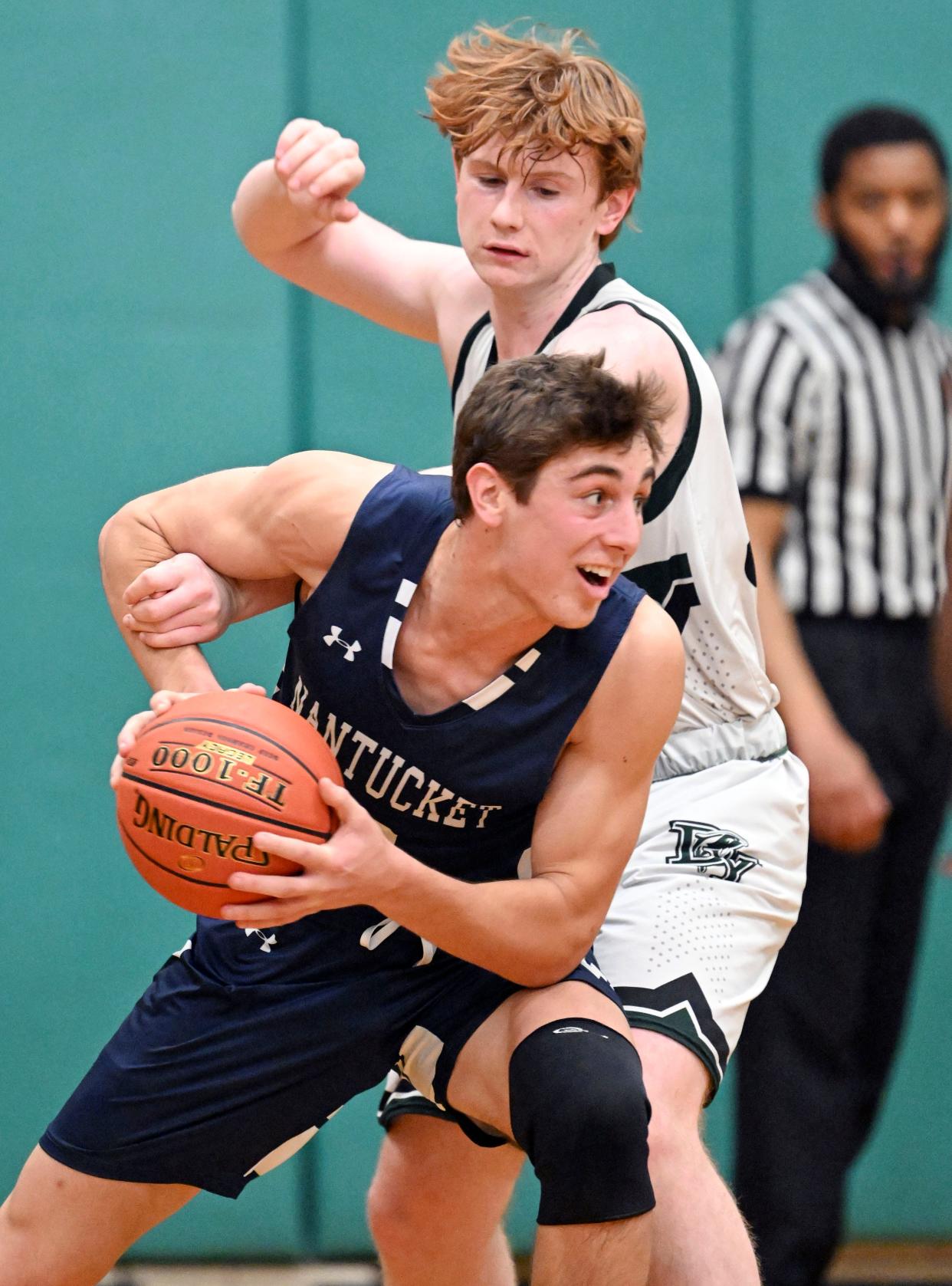 Jack Halik of Nantucket turns on John O'Neill of Dennis-Yarmouth.