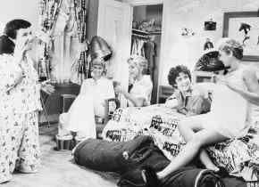 The Pink Ladies attend a slumber party in Grease. From left, Jan (Jamie McDonald), Sandy (Olivia Newton-John), Frenchie (Didi Conn), Rizzo (Stockard Channing), and Marty (Dinah Manoff). AP photo.