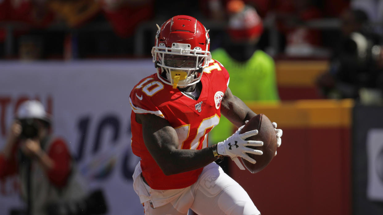 Kansas City Chiefs wide receiver Tyreek Hill (10) celebrates a touchdown during the first half of an NFL football game against the Houston Texans in Kansas City, Mo., Sunday, Oct. 13, 2019. (AP Photo/Colin E. Braley)