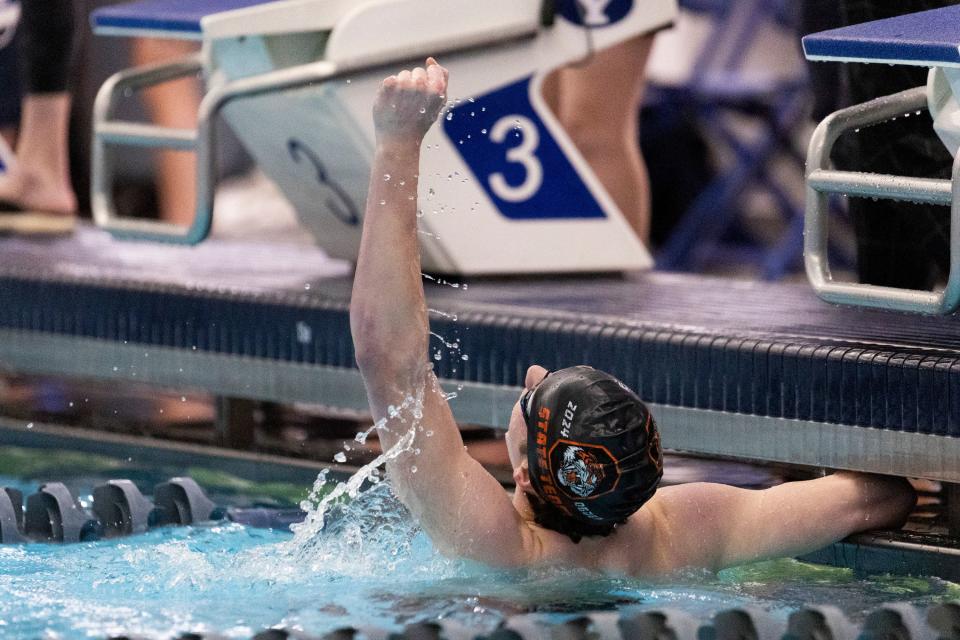 Nathan Belnap of Ogden High School celebrates after competing in the men’s 200 free at swimming preliminaries for state championships at BYU’s Richards Building in Provo on Friday, Feb. 16, 2024. | Marielle Scott, Deseret News
