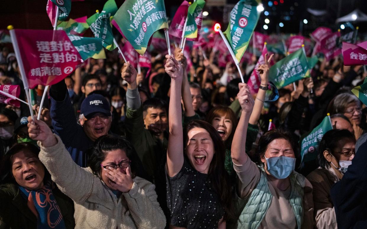 The crowd cheers at a Democratic Progressive Party rally in Taipei after Lai Ching-te was elected president