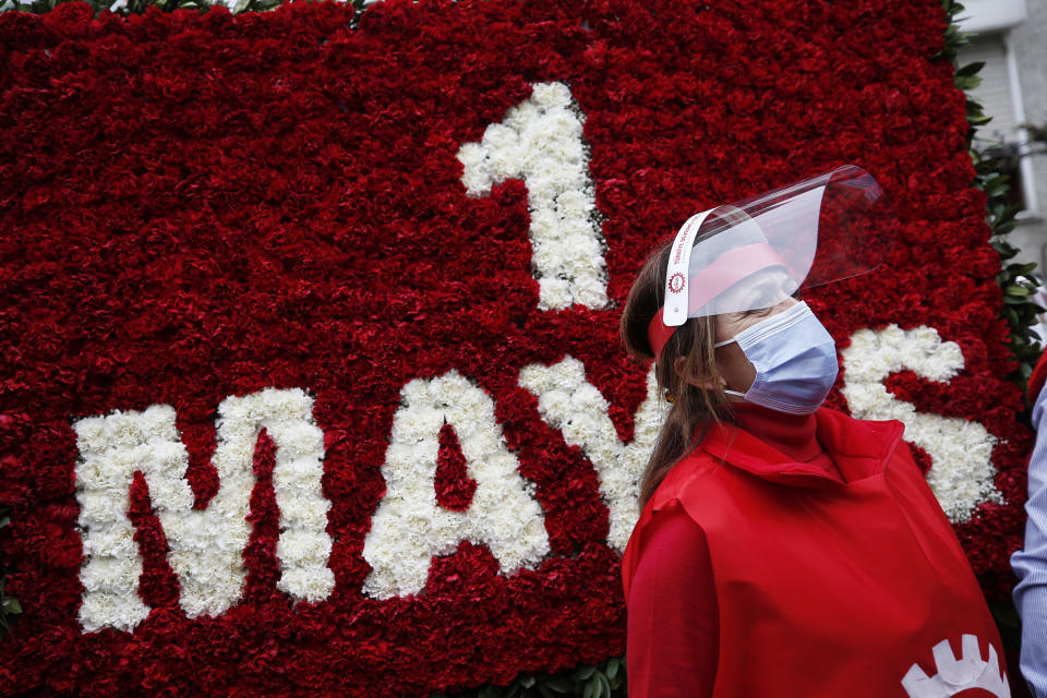 A demonstrator, wearing a face mask and shield for protection against coronavirus, stands during May Day protests in Istanbul, Friday, May 1, 2020. Police in Istanbul detained several demonstrators who tried to march toward Istanbul’s symbolic Taksim Square in defiance of the lockdown imposed by the government due to the coronavirus outbreak. (AP Photo/Emrah Gurel)