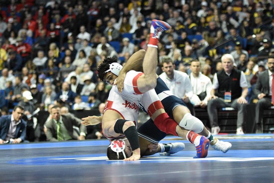 Penn State’s Carter Starocci catches Nebraska’s Mikey Labriola attempting to roll out for an escape in their 174-pound finals match of the NCAA Championships on Saturday, March 18, 2023 at the BOK Center in Tulsa, Okla. Starocci pinned Labriola after this attempt in 2:46 for his third straight title.