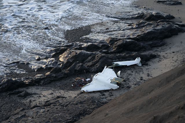 <p>Liu Guanguan/China News Service/VCG via Getty Images</p> Plane wreckage at Half Moon Bay
