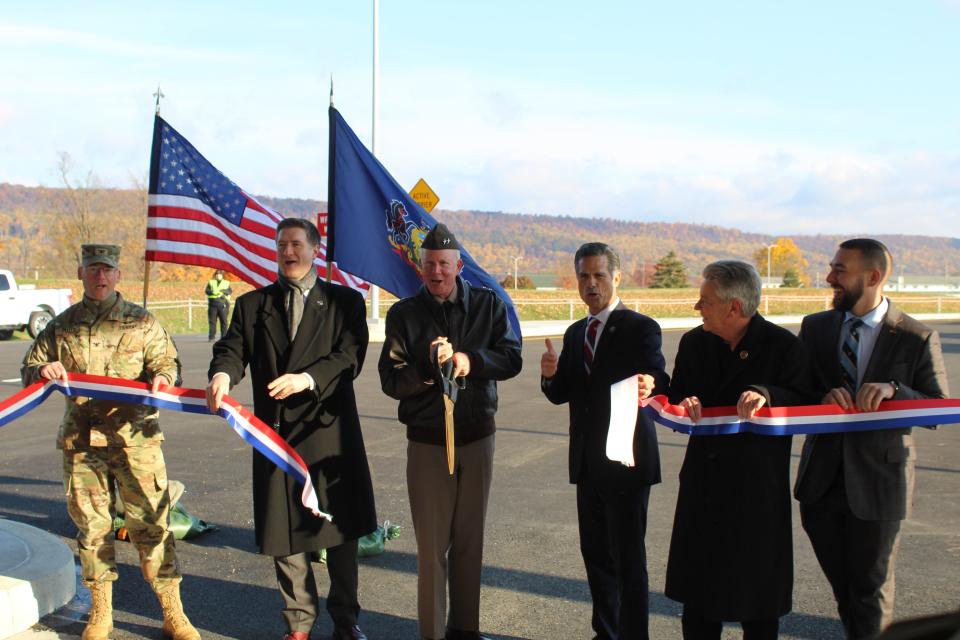 Col. Kevin Potts (left), Maj. Gen. Mark Schindler (middle left), U.S. Rep Dan Meuser (middle right) and PA House Rep Russ Diamond (second right) cut the ribbon on Fort Indiantown Gap's new main access control point.