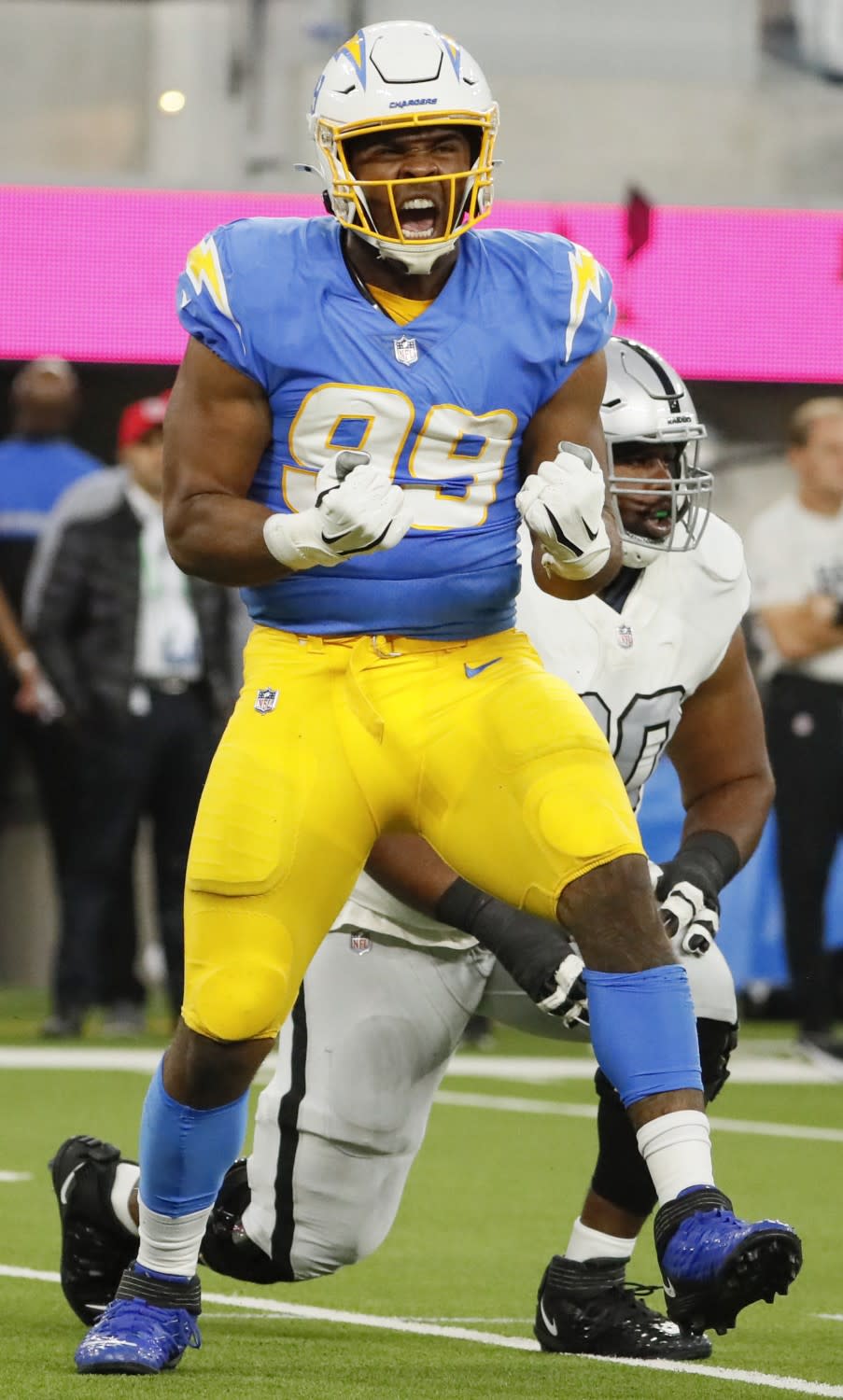 Chargers defensive tackle Jerry Tillery celebrates after sacking Raiders quarterback Derek Carr.